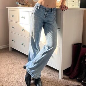 Y2K Miss Me low-rise wide leg jeans with side button detail, faded wash